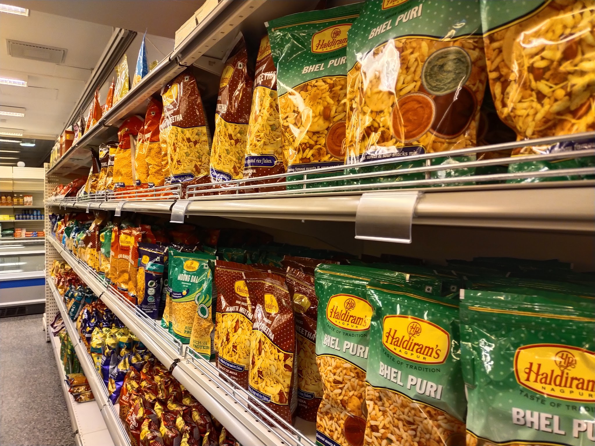 Market shelves filled with packaged snacks.